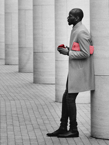 Man leaning against column